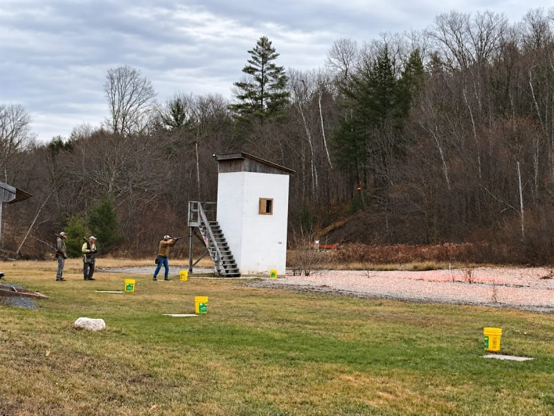 Skeet shooters beside the high house at Chester Rod and Gun Club